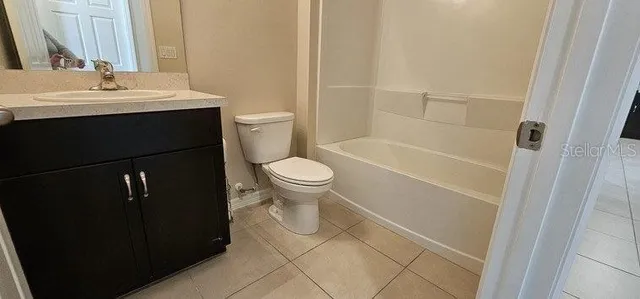 a kitchen with stainless steel appliances granite countertop wooden cabinets a sink and dishwasher