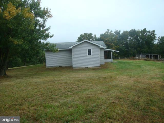 2000 Fort Valley Road Fort Valley, VA 22652 - Photo 3 of 25 a house with green field in front of it