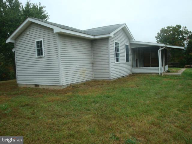 2000 Fort Valley Road Fort Valley, VA 22652 - Photo 4 of 25 a front view of a house with a garden