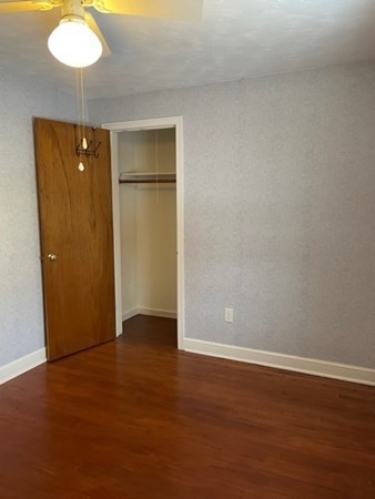 70 Woodcrest Road Springfield, MA 01129 - Photo 13 of 22 a view of an empty room with wooden floor and a window
