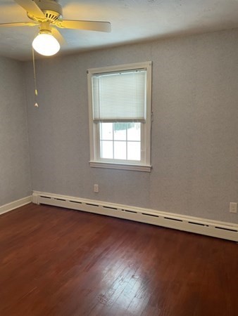 70 Woodcrest Road Springfield, MA 01129 - Photo 14 of 22 an empty room with wooden floor and windows