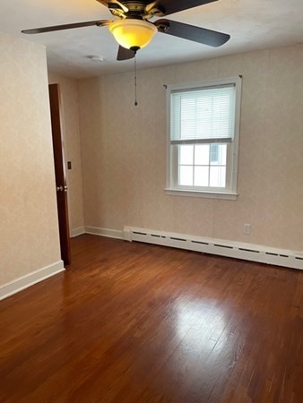 70 Woodcrest Road Springfield, MA 01129 - Photo 15 of 22 an empty room with wooden floor and windows