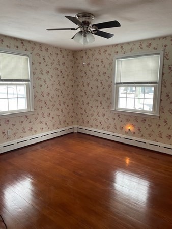 70 Woodcrest Road Springfield, MA 01129 - Photo 18 of 22 an empty room with wooden floor and windows