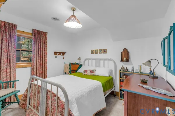 a bedroom with a bed and a table