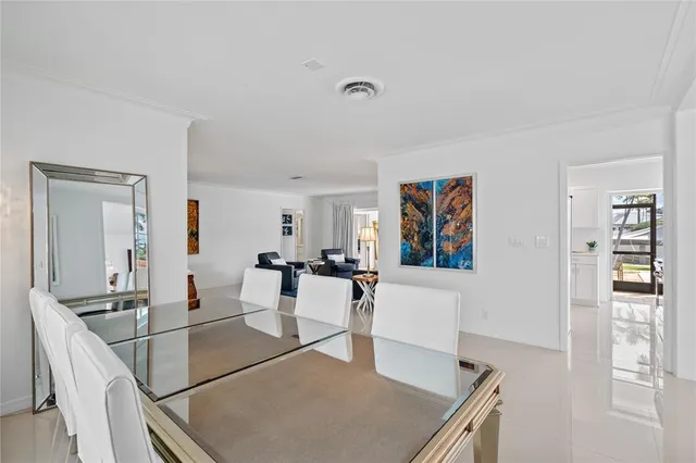 a view of a living room and dining room