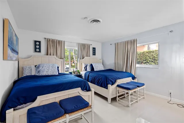 a bedroom with a bed and a table