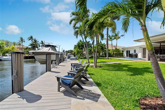 a view of a swimming pool with a patio and a garden