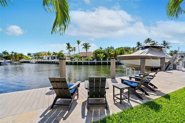 a view of a lake with a table and chairs