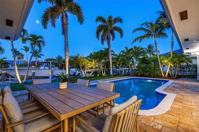 an outdoor space with furniture and wooden floor