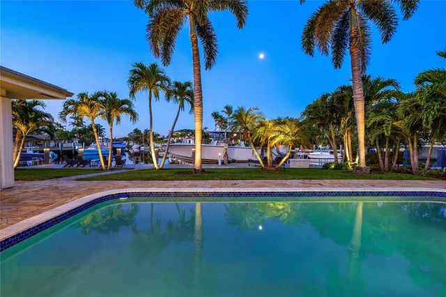 a view of a swimming pool with an outdoor space and seating area