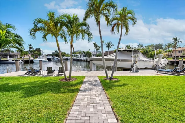 a view of a swimming pool with a table and chairs
