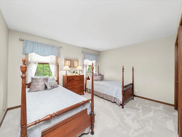 a living room with furniture and a projector screen