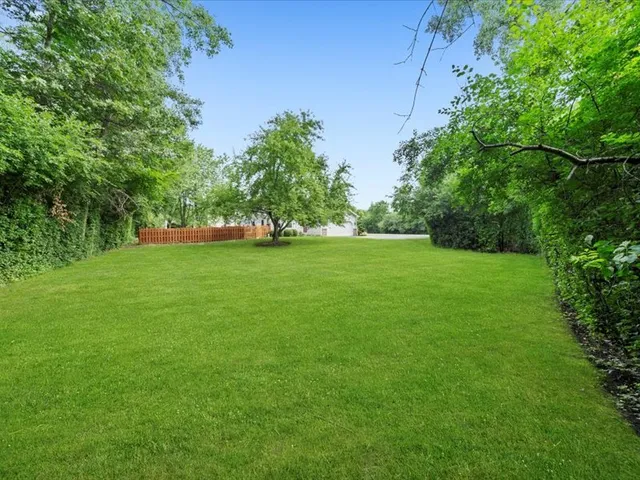 a view of a backyard with sitting area