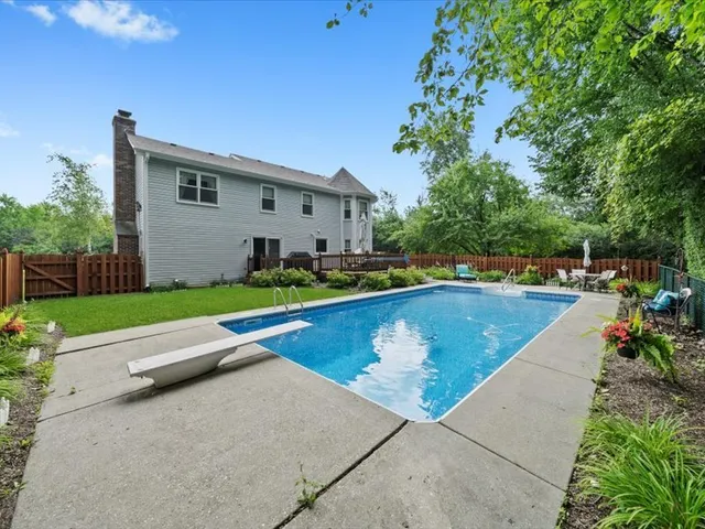 a view of a wooden deck with furniture