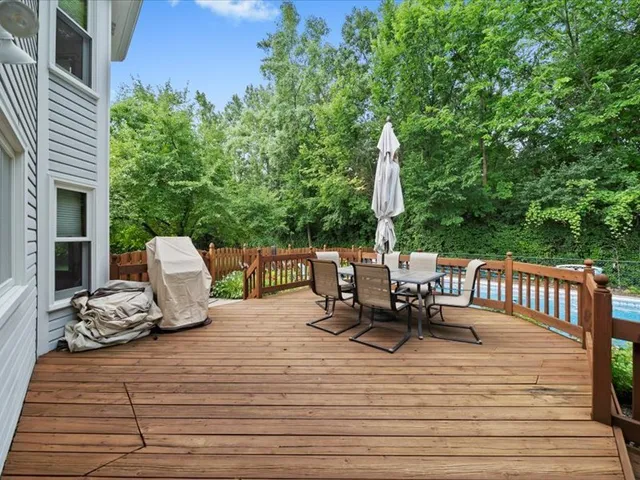 a view of a patio with a table and chairs