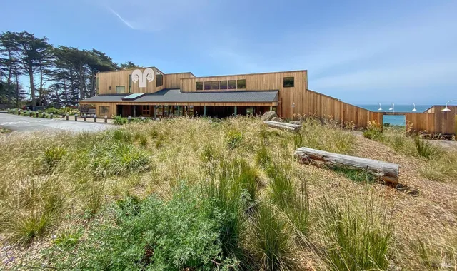 a front view of a building with garden