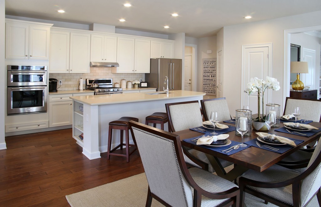 2 Jackson Drive, Unit 72 Upton, MA 01568 - Photo 5 of 13 a kitchen with a dining table chairs and microwave