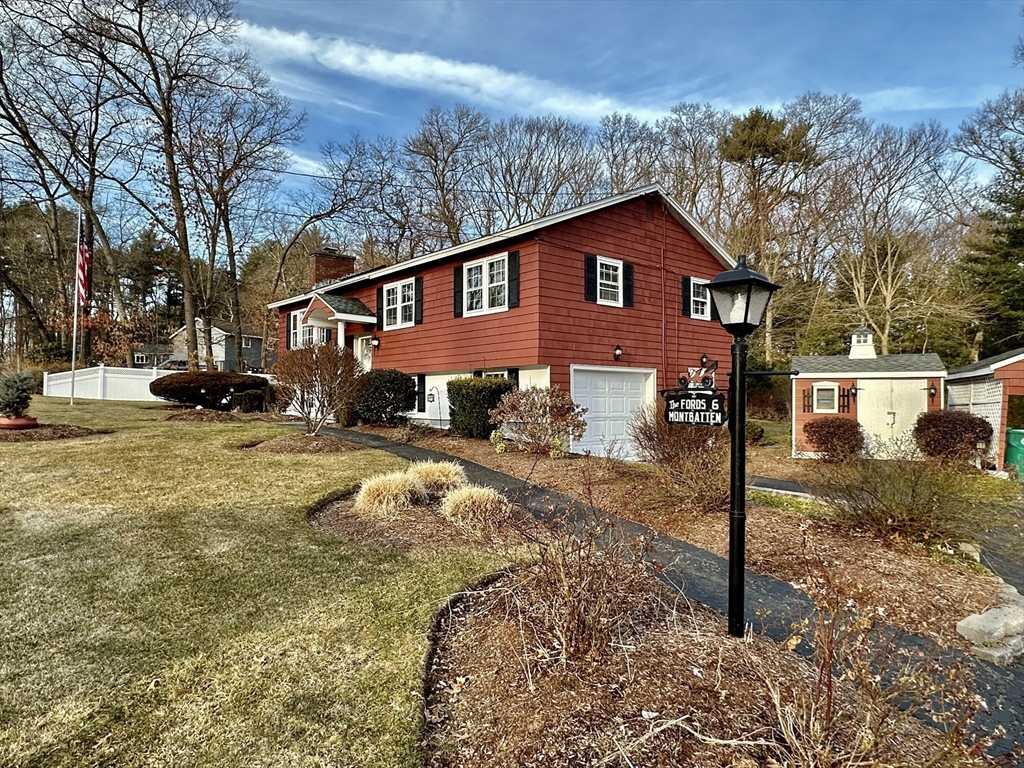 6 Montbatten Road Billerica, MA 01821 - Photo 3 of 22 a view of a house with a yard covered in snow