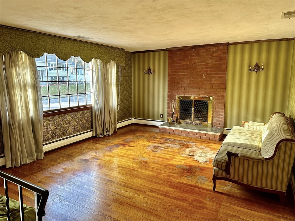 6 Montbatten Road Billerica, MA 01821 - Photo 6 of 22 a view of a livingroom with furniture and a fireplace