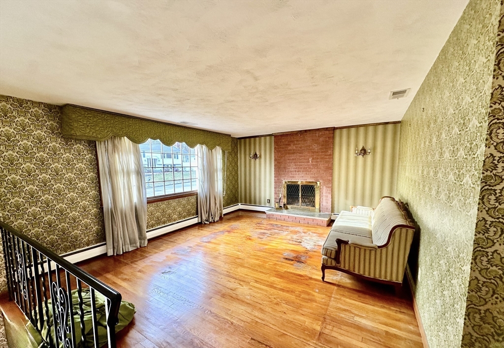 6 Montbatten Road Billerica, MA 01821 - Photo 7 of 22 a view of an empty room with wooden floor and a window