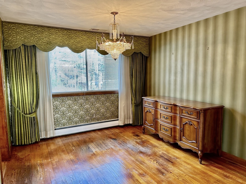 6 Montbatten Road Billerica, MA 01821 - Photo 8 of 22 wooden floor in an empty room with a window