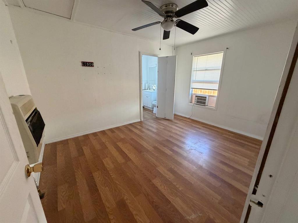 812 Tennessee Street Graham, TX 76450 - Photo 12 of 21 a view of an empty room with a window