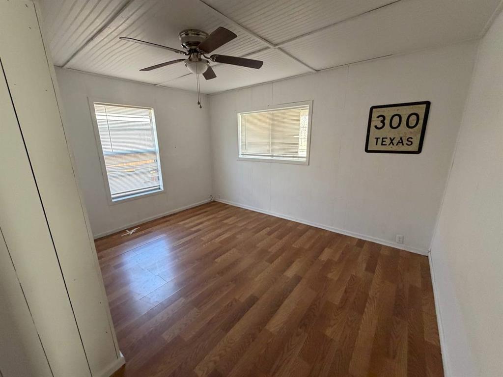 812 Tennessee Street Graham, TX 76450 - Photo 7 of 21 a view of an empty room and a window