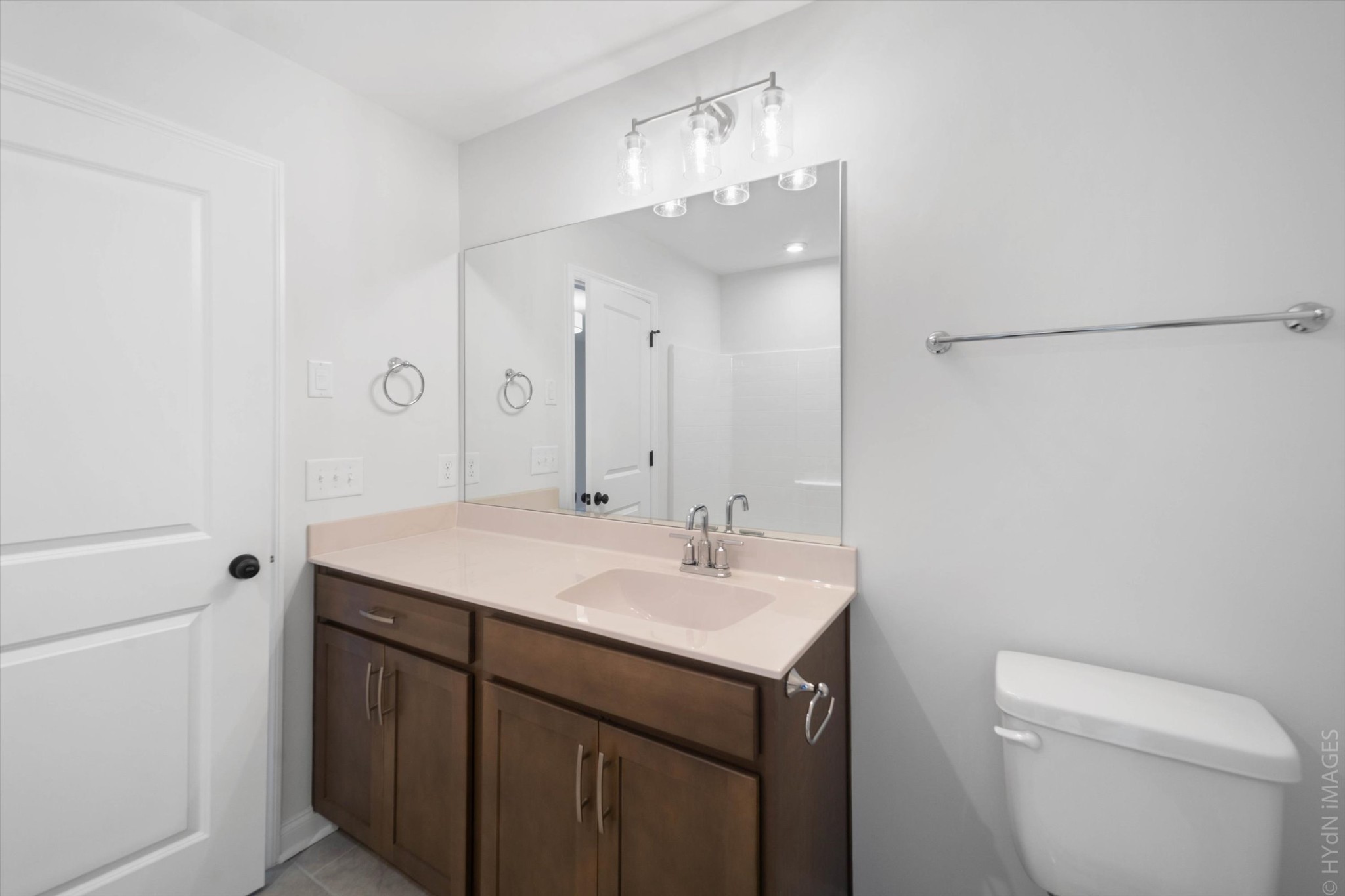 88 Remington Road Lebanon, TN 37090 - Photo 34 of 50 a bathroom with a sink a toilet a large mirror and shower