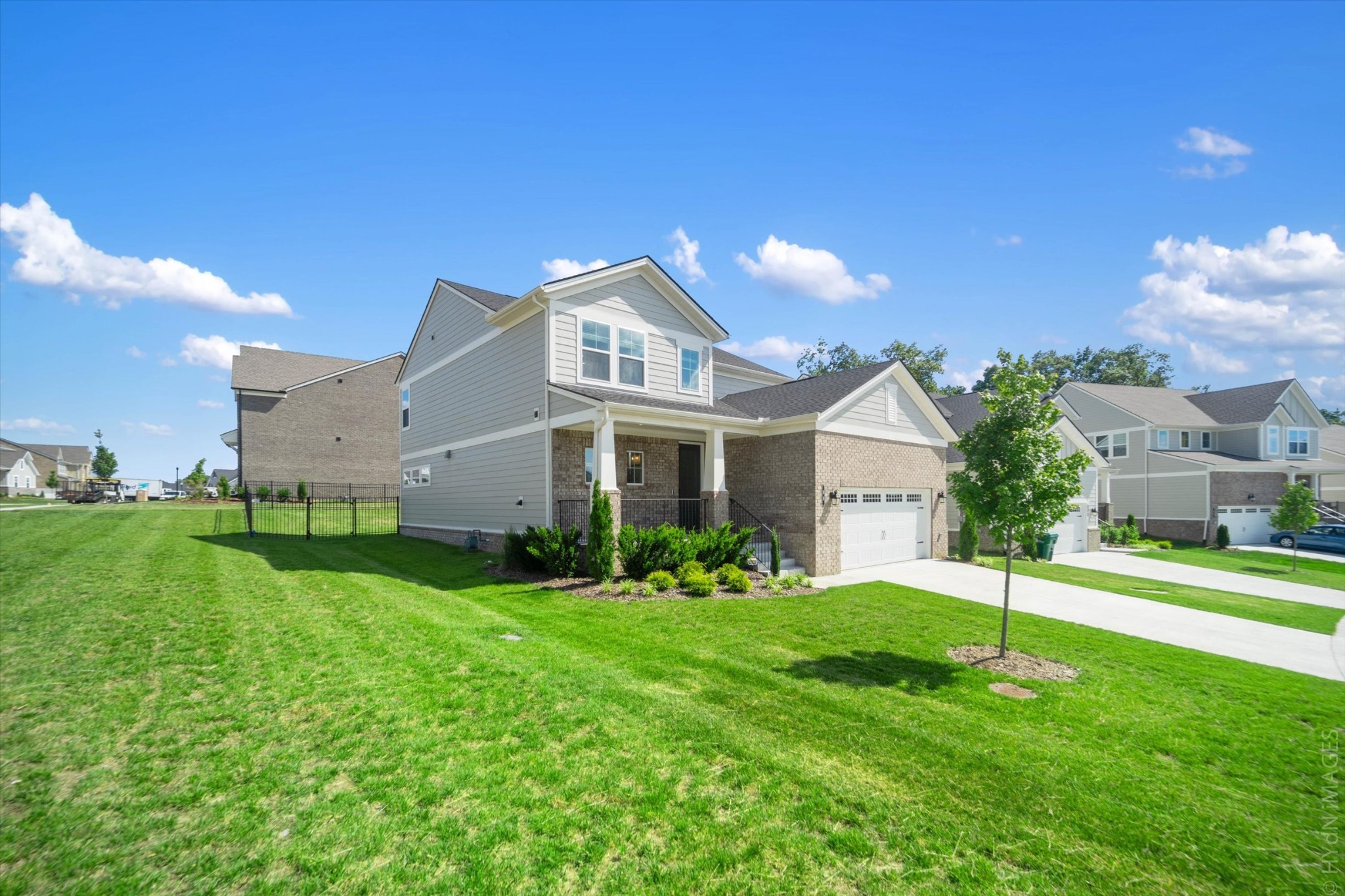 88 Remington Road Lebanon, TN 37090 - Photo 4 of 50 a front view of a house with a yard and garage