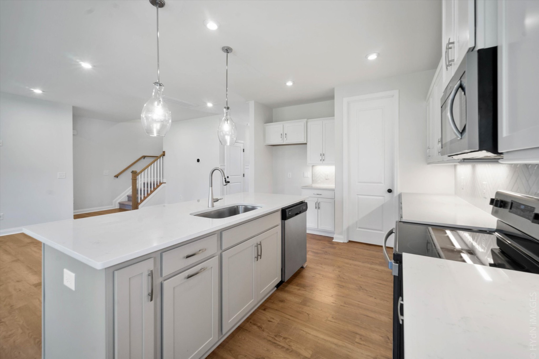 88 Remington Road Lebanon, TN 37090 - Photo 6 of 50 a large kitchen with stainless steel appliances kitchen island a large island a sink a stove and a refrigerator