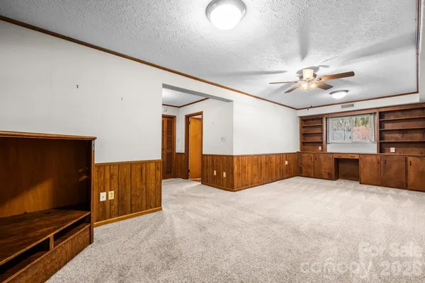 a view of an empty room with a flat screen tv