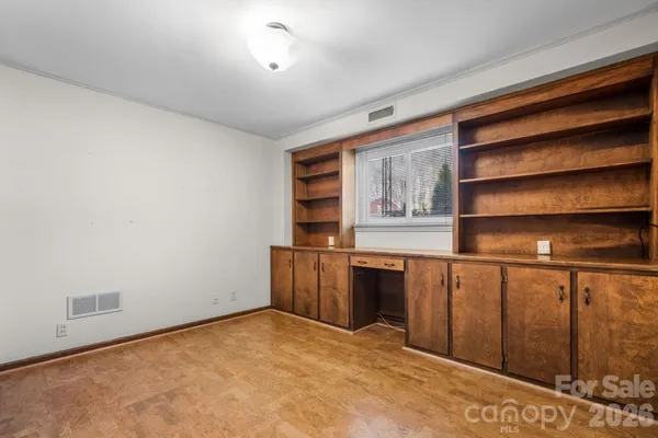 a room with closet and wooden floor