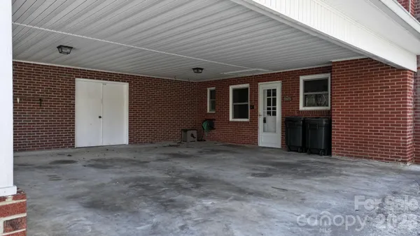 a view of a house with a yard and garage
