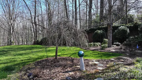 a backyard of a house with lots of green space