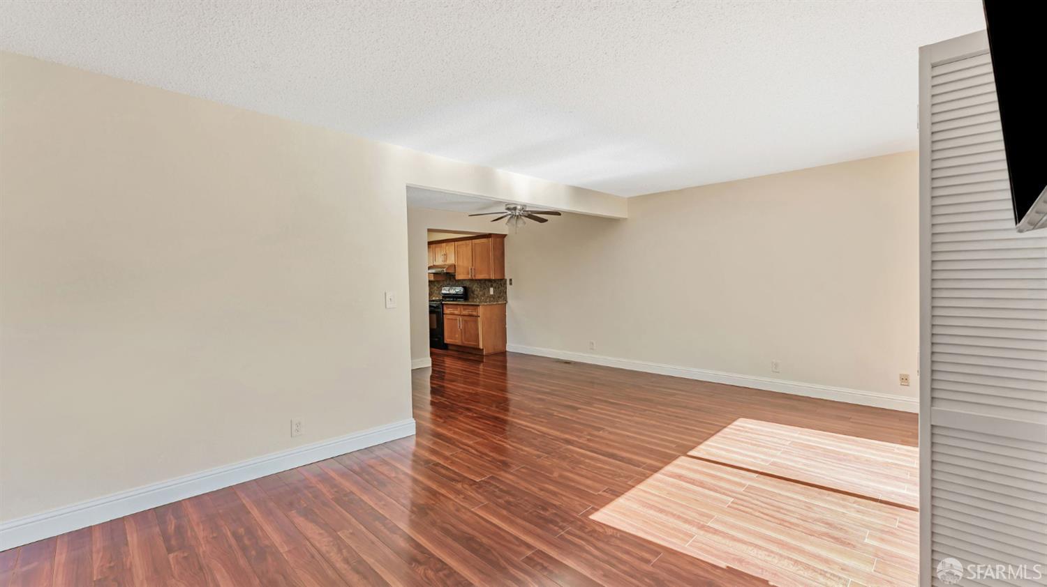 107 Alice Lane El Sobrante, CA 94803 - Photo 11 of 39 a view of an empty room with wooden floor and a window
