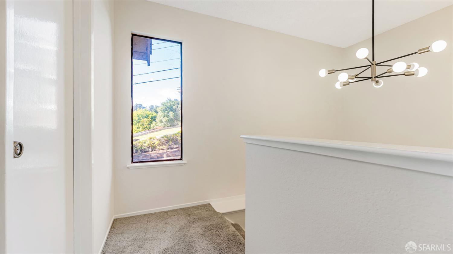 107 Alice Lane El Sobrante, CA 94803 - Photo 19 of 39 a view of a hallway with a window
