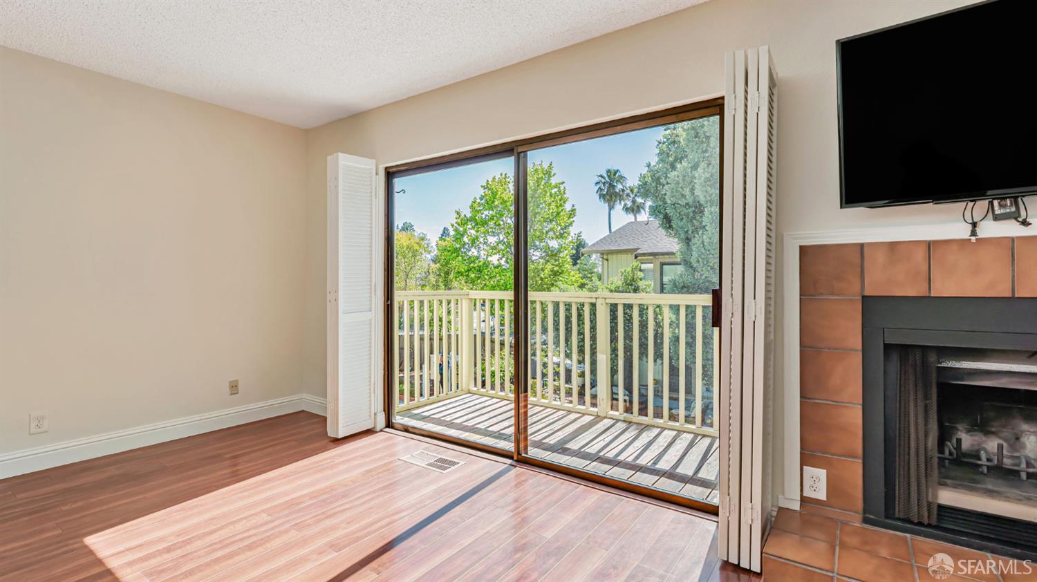 107 Alice Lane El Sobrante, CA 94803 - Photo 3 of 39 a view of a room with wooden floor and a fireplace