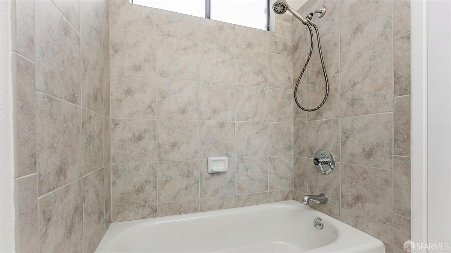 107 Alice Lane El Sobrante, CA 94803 - Photo 32 of 39 a bathroom with a bath tub with a shower