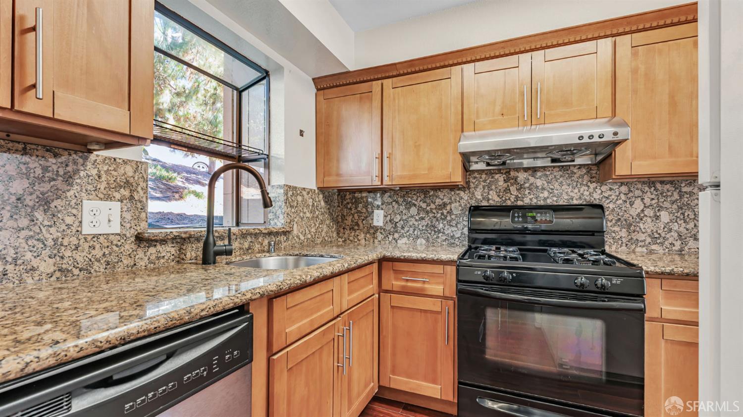 107 Alice Lane El Sobrante, CA 94803 - Photo 6 of 39 a kitchen with granite countertop a stove sink and cabinets
