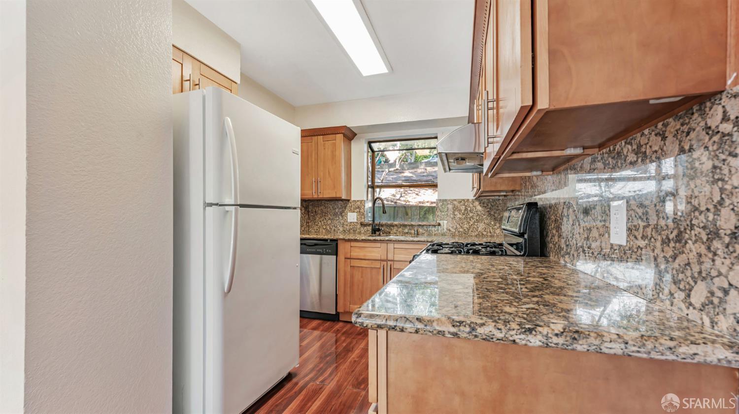 107 Alice Lane El Sobrante, CA 94803 - Photo 7 of 39 a kitchen with refrigerator and window