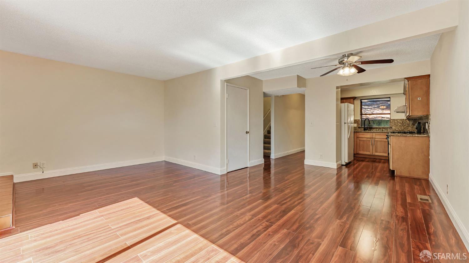 107 Alice Lane El Sobrante, CA 94803 - Photo 9 of 39 wooden floor in an empty room with a window