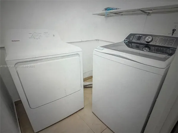 a utility room with dryer and washer