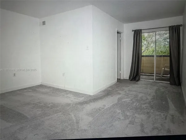 a view of an empty room and window