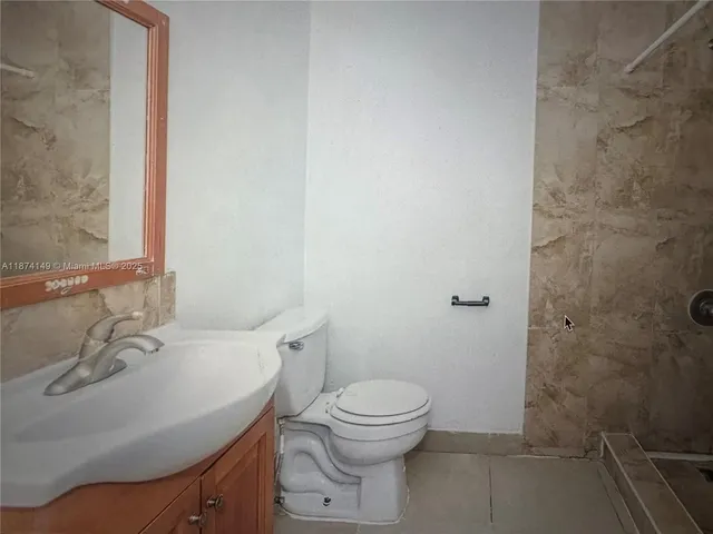 a view of an empty room with wooden door