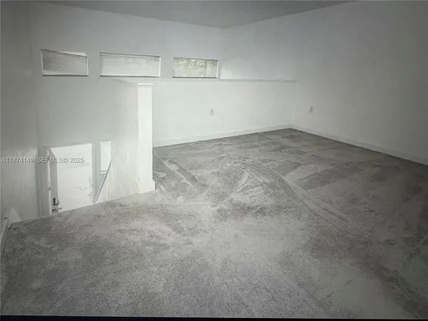 a view of a room with an empty space