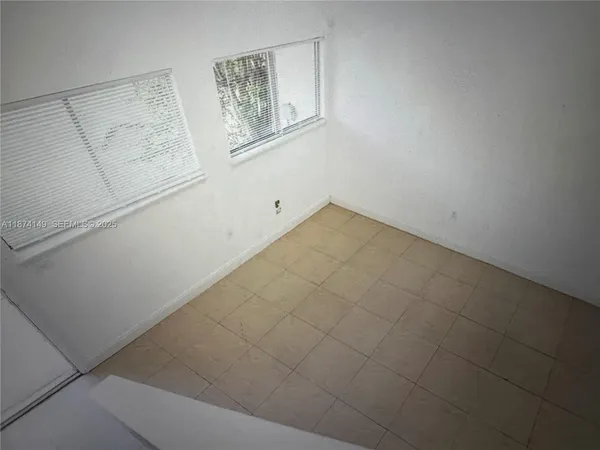 a view of a refrigerator in kitchen