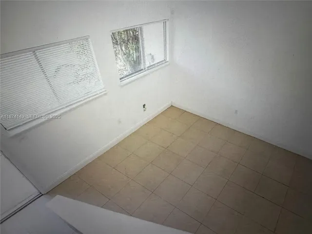 a view of a refrigerator in kitchen