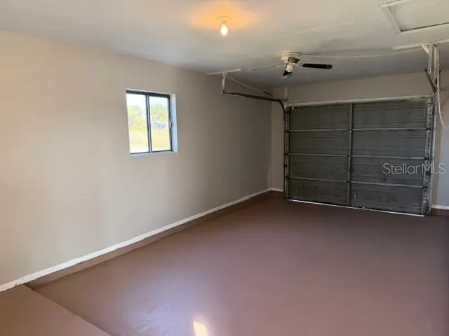 a view of an empty room with a fireplace