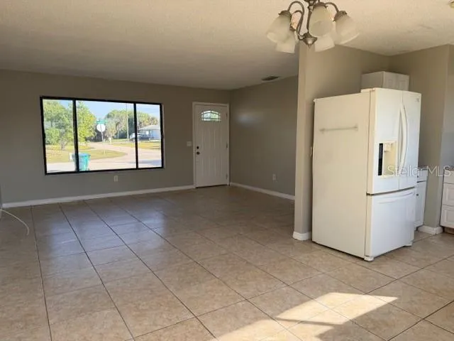 a view of a livingroom with furniture and a window