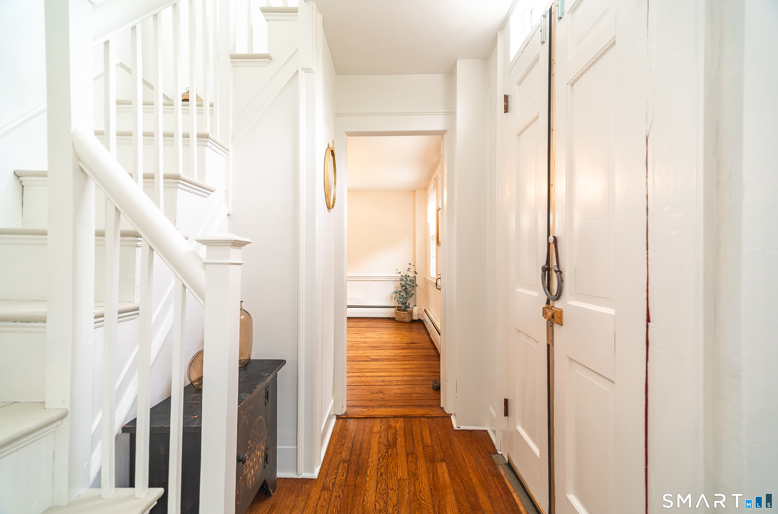 230 Killingworth Road Haddam, CT 06441 - Photo 16 of 36 a view of a hallway with wooden floor and staircase
